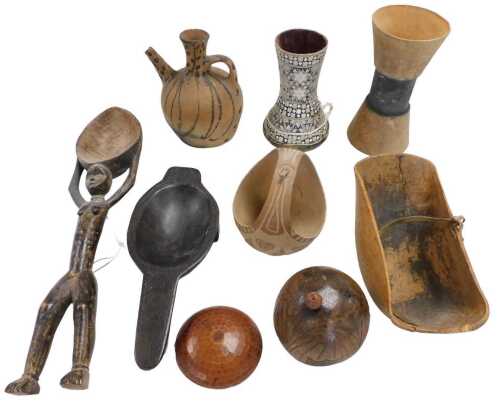 Assorted African and other cooking vessels, including ladles, a bowl, together with a carved...