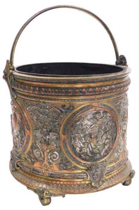 A late 19thC Continental copper brass and plated coal bucket, with elaborate Renaissance-style...