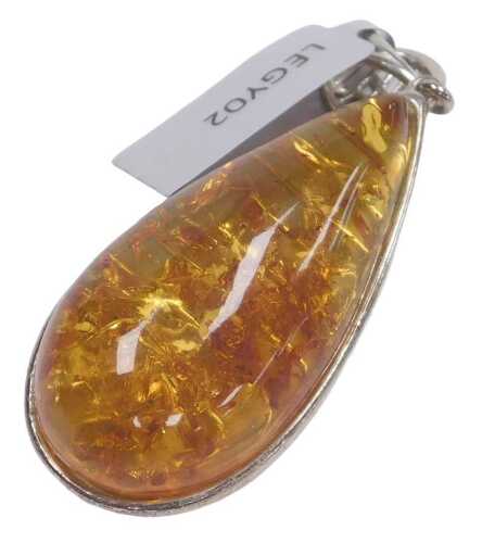 A silver and baltic amber teardrop pendant, with an openwork circular suspension, amber 4cm high.