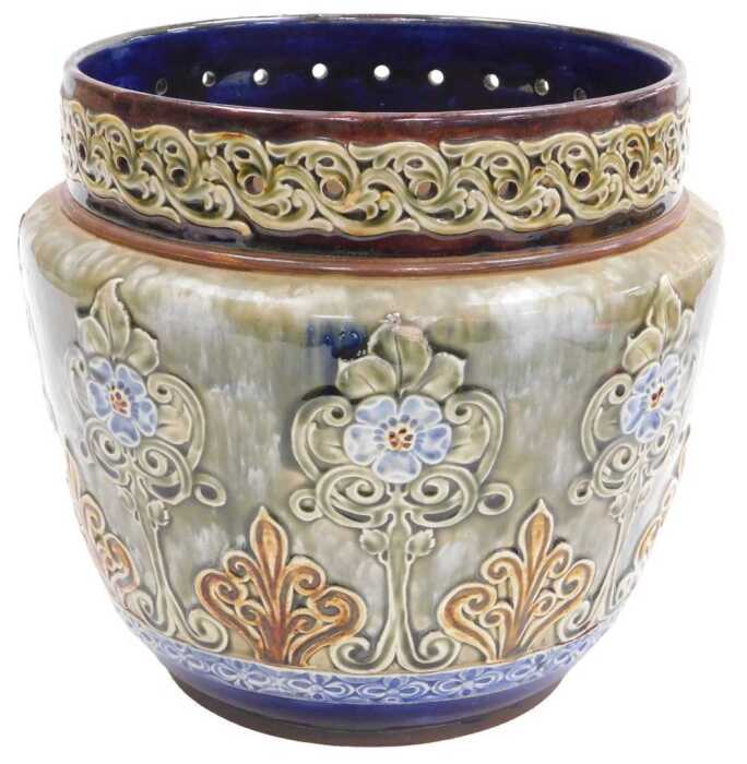 A 19thC Doulton Lambeth jardiniere, decorated with flowers, scrolls, etc., on a mottled green,...