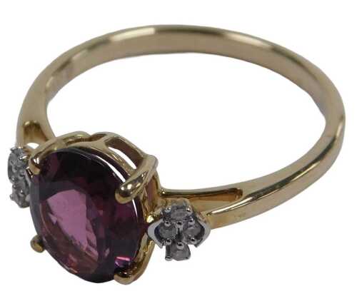 A 9ct gold and spinel solitaire ring, claw set with diamond set shoulders, size N&frac12;, 2.3g.
