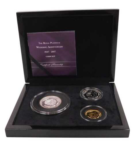 A Royal Platinum Wedding Anniversary three coin set 2017, comprising a 9ct gold double crown, 4g,...