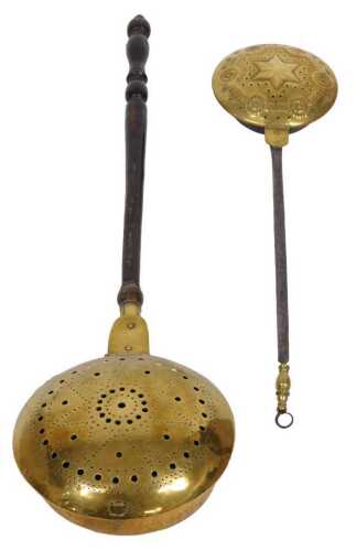 A 19thC pierced brass warming pan, with a turned wooden handle, 111cm long, and a smaller...