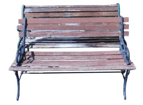A cast iron and wooden garden bench, with green ends decorated with pierced floral and scroll...