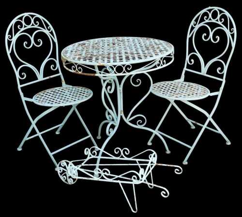A green painted cast iron garden bistro set, comprising of a pair of spoon back chairs, and a...