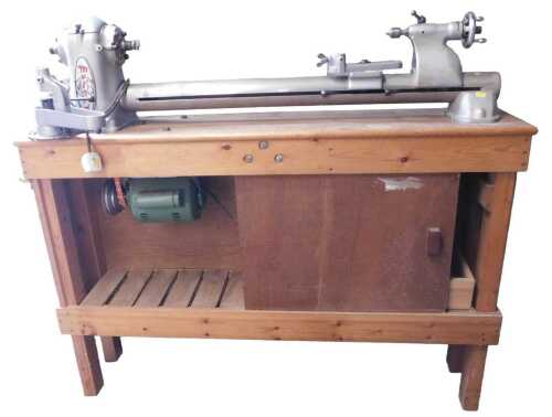 A Myford ML8 wood turning lathe, on a pine base.