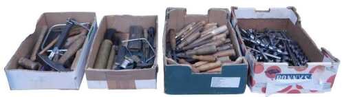 A group of woodworking tools, including chisels and gouges, saws, and drill bits. (1 shelf)