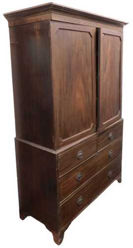 A George III mahogany linen press, the outswept pediment over a pair of doors enclosing four...