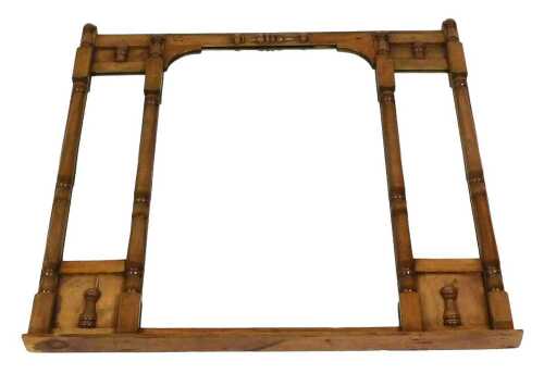 A Victorian pitch pine overmantel mirror, the pediment over a central square mirror, flanked by...