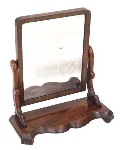 A Victorian mahogany swing framed toilet mirror, with a rectangular mirror plate, the base of...