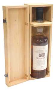 A bottle of Bladnoch Lowland single malt scotch whisky, aged 10 years, in a fitted box.