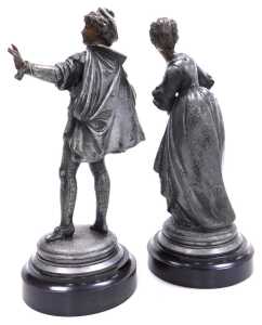 A pair of 19thC polished spelter figures of a gentleman and a lady, 26cm and 25cm high, a white... - 2