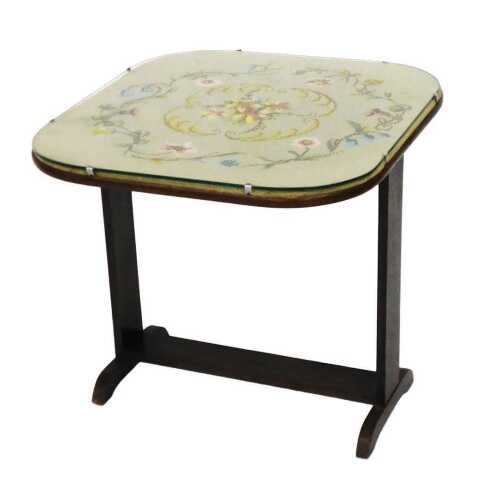 An early 20thC oak tilt top occasional table/fire screen, the curved square top with woolwork...