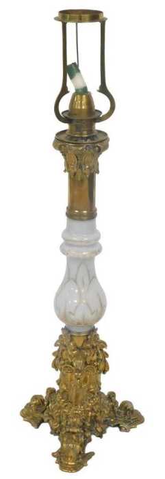 A late 19thC brass and white opaque glass table lamp, decorated with scrolls, flowers, etc., the...