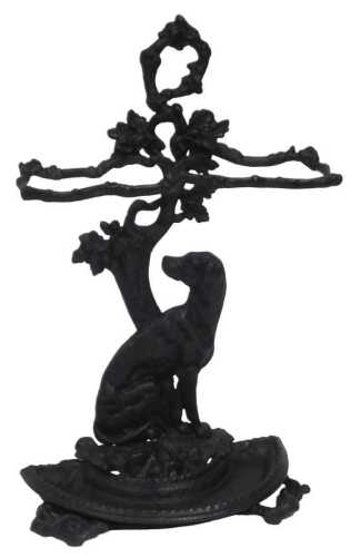 A Victorian cast iron stick stand, modelled as a dog and oak tree, with twin division openings,...