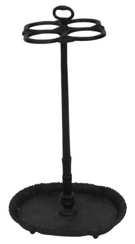 A Victorian cast iron four division stick stand, raised on an oval base with a repeating leaf...