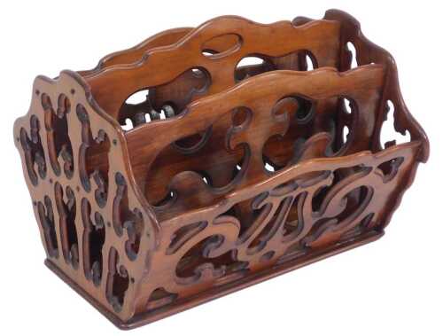 A Victorian Gothic mahogany Canterbury of four division form, 37cm high, 47cm wide, 40.5cm deep.