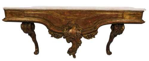 A Continental gilt console table, with a white marble top, with foliate, C scroll and floral...