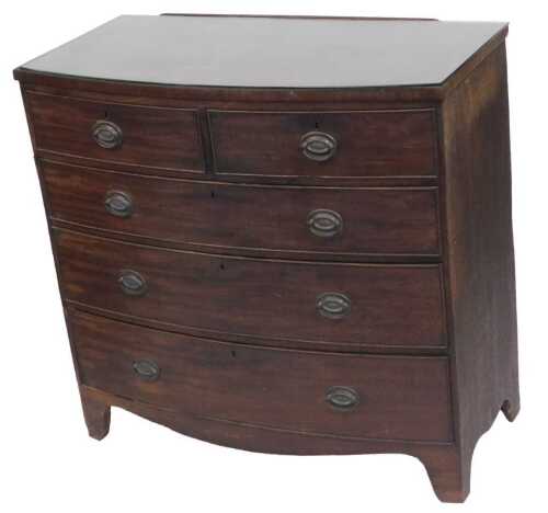 A George III mahogany bow front chest, of two short over three long graduated drawers, raised on...
