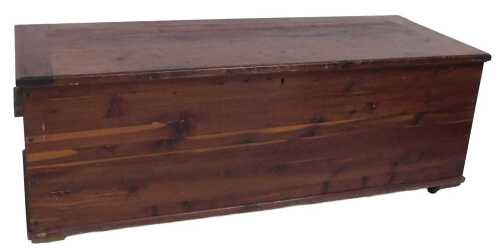 An early 20thC Smart & Brown Limited stained pine blanket chest, on castors, 45cm high, 123cm...
