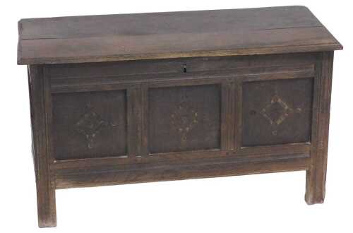 An 18thC oak coffer, with a triple panelled front, raised on stiles, 62cm high, 109cm wide, 48cm...