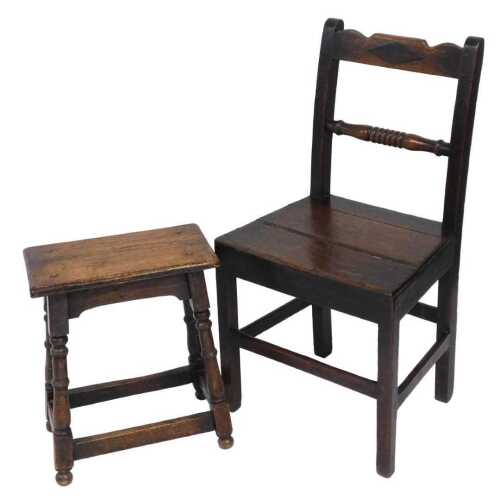 A Regency oak country chair, with a solid seat, raised on square legs united by a box stretcher,...