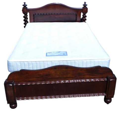 A late Victorian mahogany double bed frame, comprising headboard and footboard, bed base, metal...