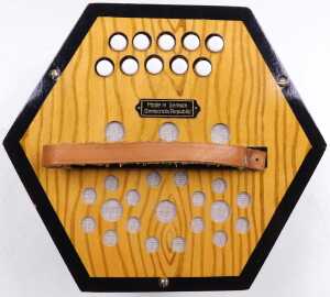 A late 20thC German Democratic Republic Scholer accordion, ten button, boxed. - 3