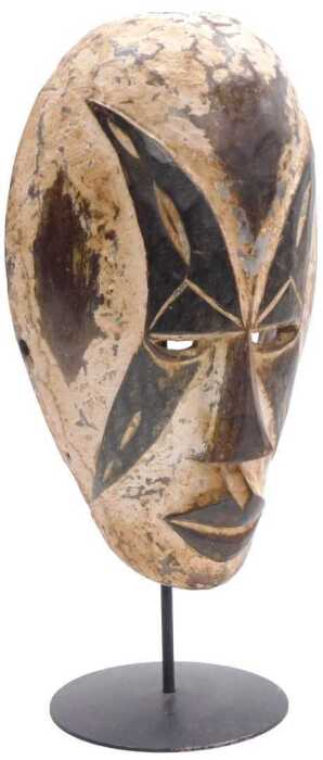 A Gabonese Galoa carved wooden tribal mask, on a metal stand, 35cm high.