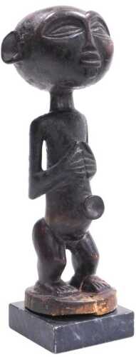 An African tribal Congolese Tabwa figure, raised on a stone plinth, 23cm high.