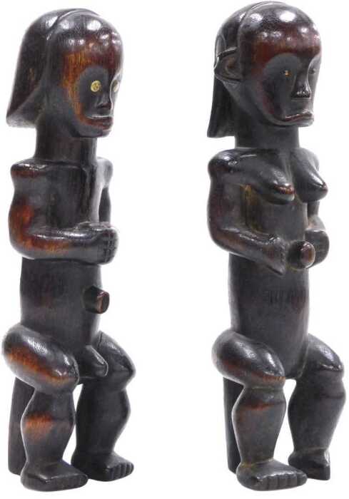 A pair of Gabonese Fang tribal reliquary male and female figures, 29cm high.