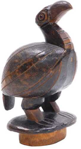 A carved tribal figure of a flightless bird, on an oval base, 26cm high. (AF)