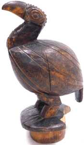 A carved tribal figure of a flightless bird, on an oval base, 26cm high. (AF) - 2