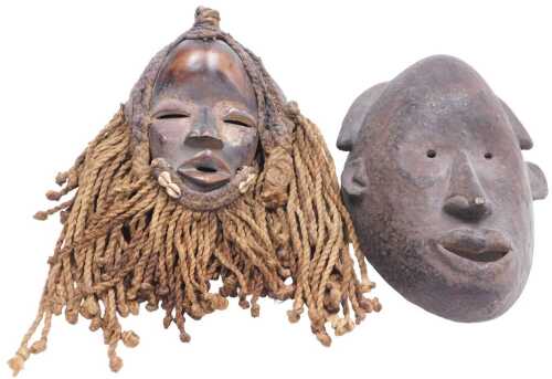 A Dan tribal female figure, embellished with rope and shells, 31cm high, and a carved Dan tribal...