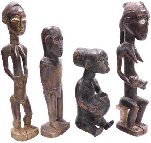 Two similar Dogon fertility figures, each embellished in white, both 40cm high, and two further...