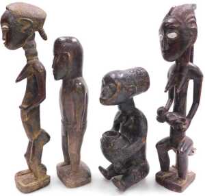 Two similar Dogon fertility figures, each embellished in white, both 40cm high, and two further... - 2