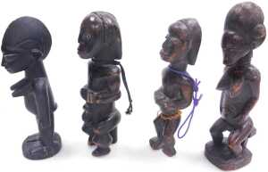 An African Baule fertility figure, on a rectangular base, 31cm high, and three further tribal... - 2