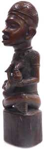 An African Yombe Congolese maternity figure, raised on a tapering base, 33cm high. - 2
