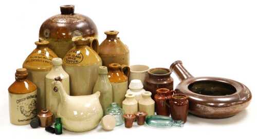 A group of 19thC and later stone jars and bottles, including a jar for J Nickolls, Sleaford 699,...