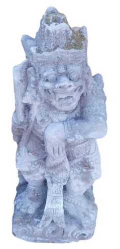 A Balinese stone figure of a Dvarapala temple guardian, modelled in a fierce standing pose, on a...