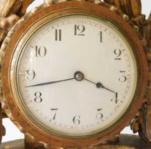 An early 19thC French giltwood mantel clock, the 9cm diameter enamel Arabic dial, held in a... - 2