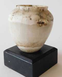 An Egyptian alabaster vase, on an ebonised base, 13cm high. Offsite Sale - Buying & Collecting... - 2