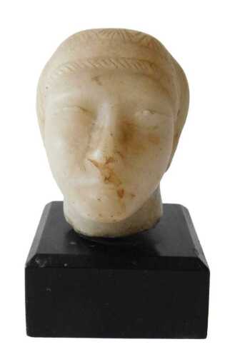 An ancient Greek alabaster head, on an ebonised base, 14cm high. Offsite Sale - Buying &...