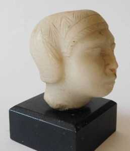 An ancient Greek alabaster head, on an ebonised base, 14cm high. Offsite Sale - Buying &... - 2