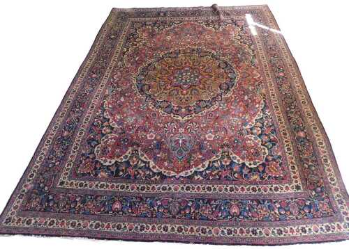 A vintage Persian carpet section, of rectangular form, the outer field with a repeat geometric...