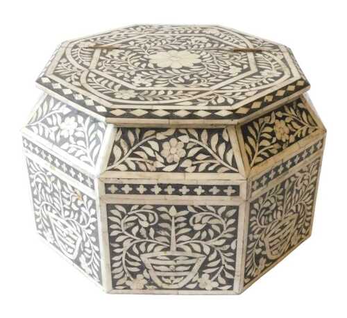 An Indian bone inlaid and ebonised box, of octagonal form, profusely decorated with scrolls and...