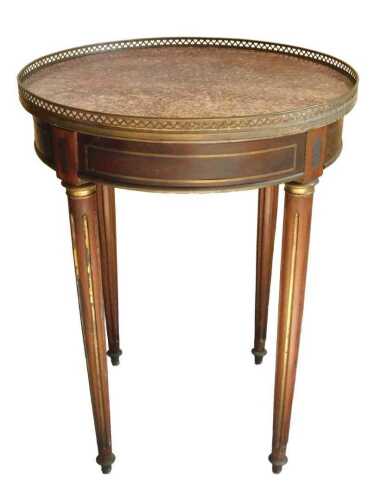 A 19thC French mahogany Louis XVI style occasional table, of circular form, the red marble top...
