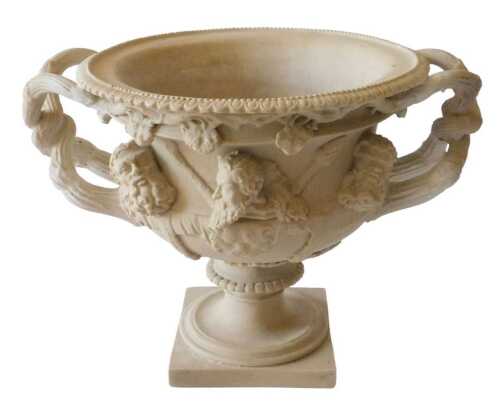 A replica Warwick style composition urn, profusely decorated with figure heads with entwined...