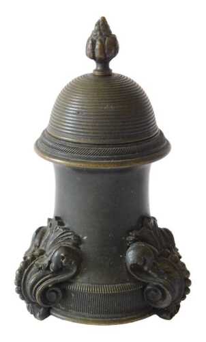 A 19thC Italian Grand Tour style bronze inkwell, the shaped domed lid with urn finial, revealing...