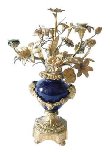 A 19thC French Sevres style porcelain and ormolu candelabra centrepiece, profusely decorated...